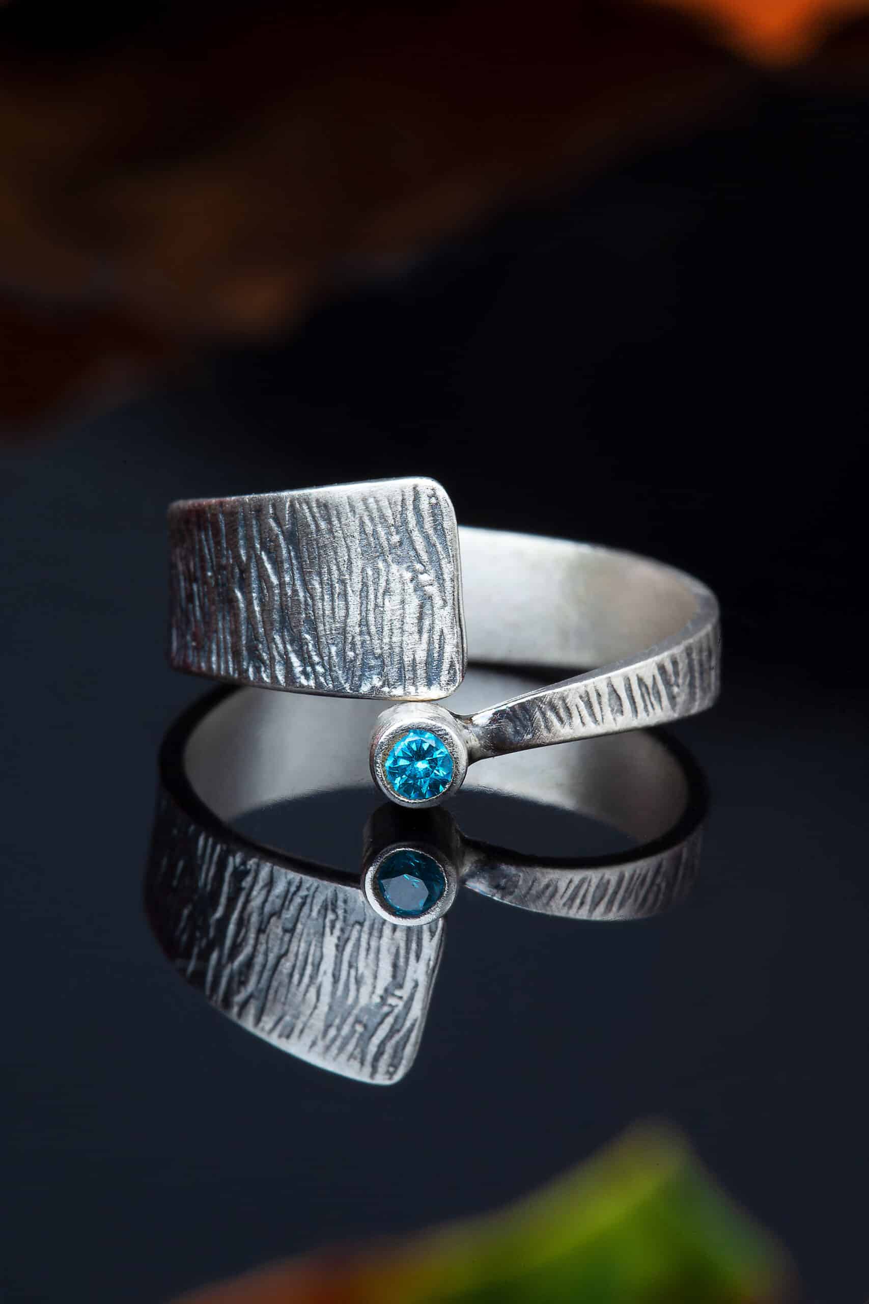 Minimal textured silver ring with blue zircon gallery 2