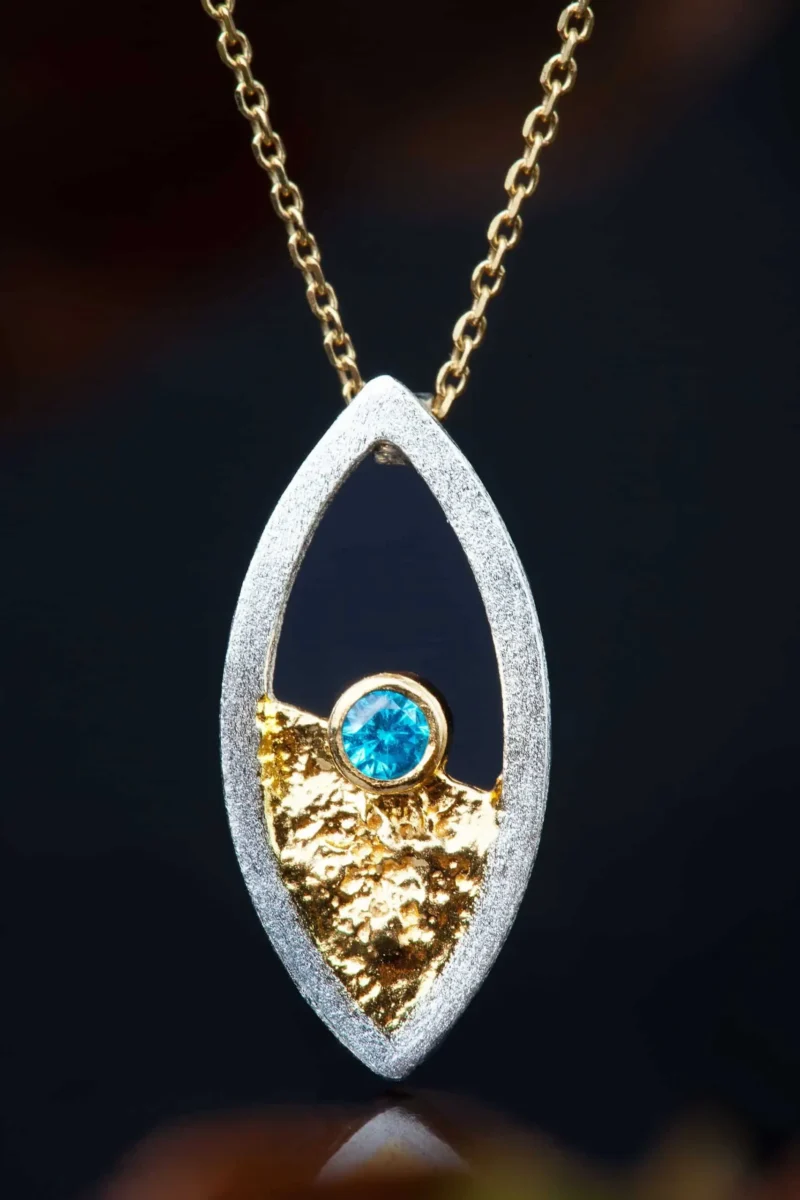 Handmade Jewellery | Oval silver necklace with blue zircon gallery 1