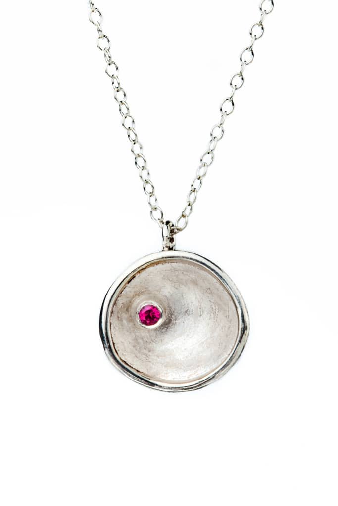 Round silver pendant with garnet main