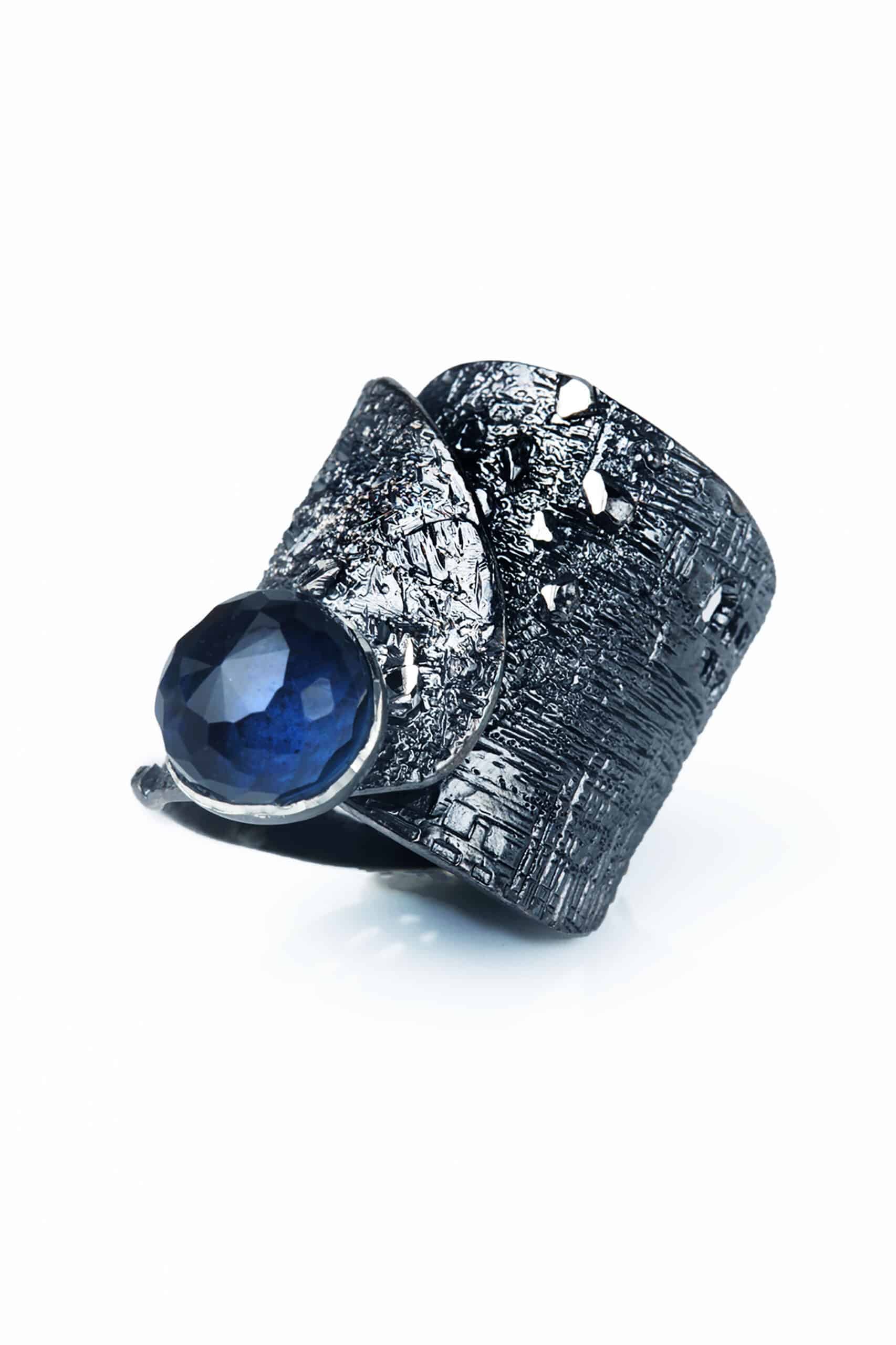Black plated silver ring with blue crystal main
