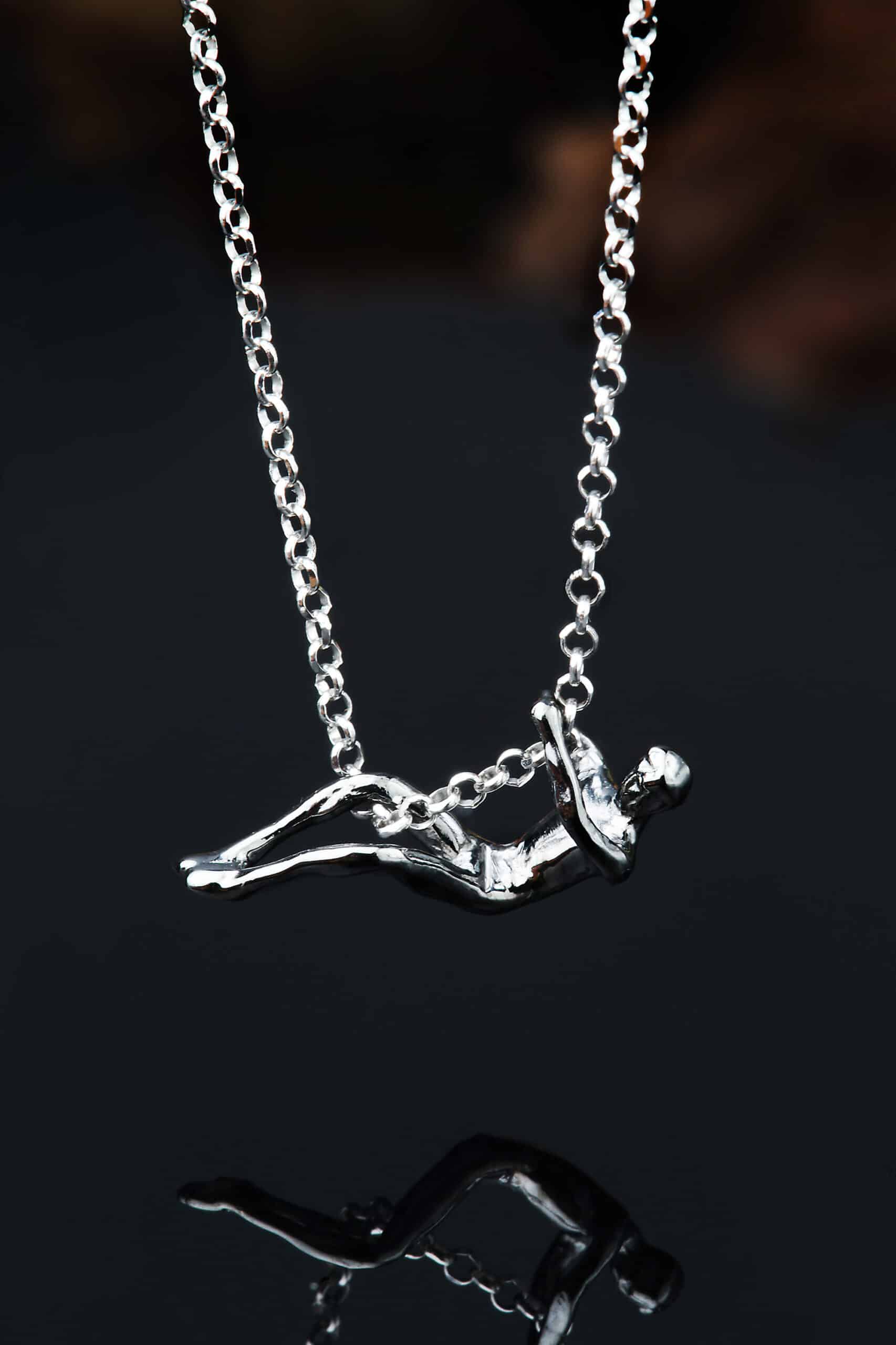 Male figure rhodium plated silver necklace main