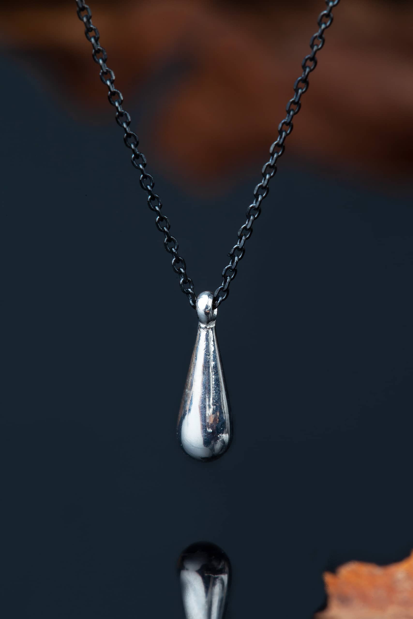 Drop rhodium plated silver pendant main