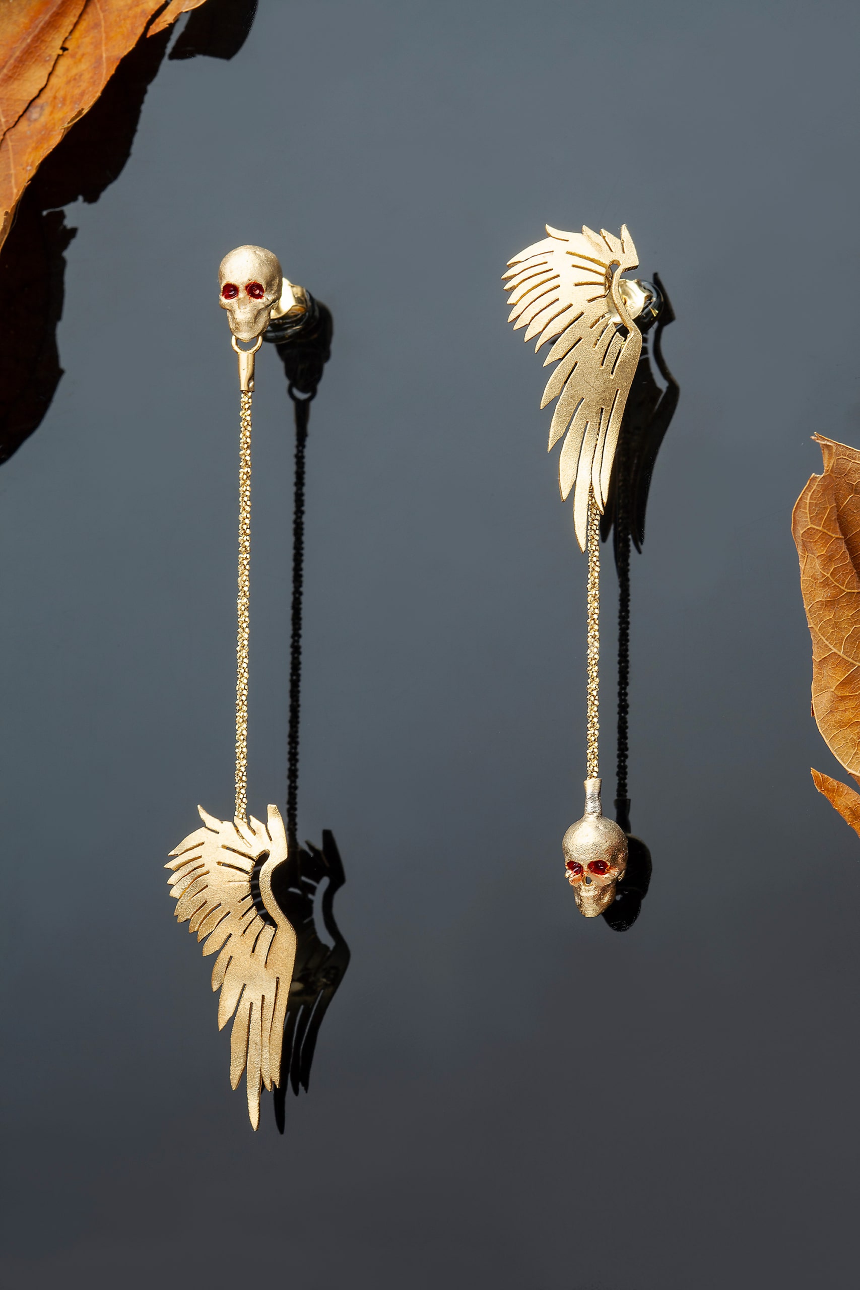Wing and skull gold plated silver earrings main