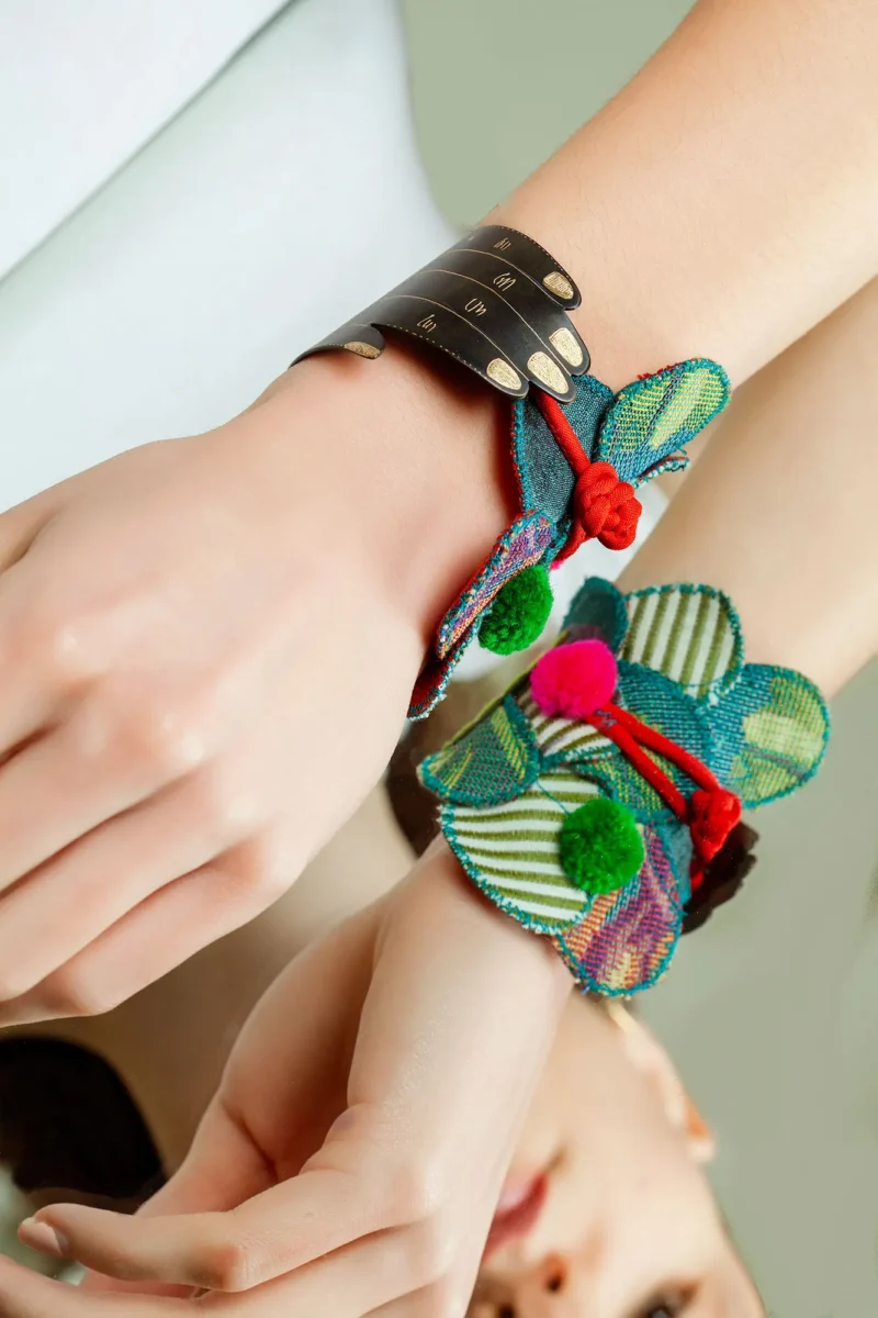 Handmade Jewellery | Hand Engraved Bracelet with Vibrant Fabrics and Playful Pompoms gallery 1