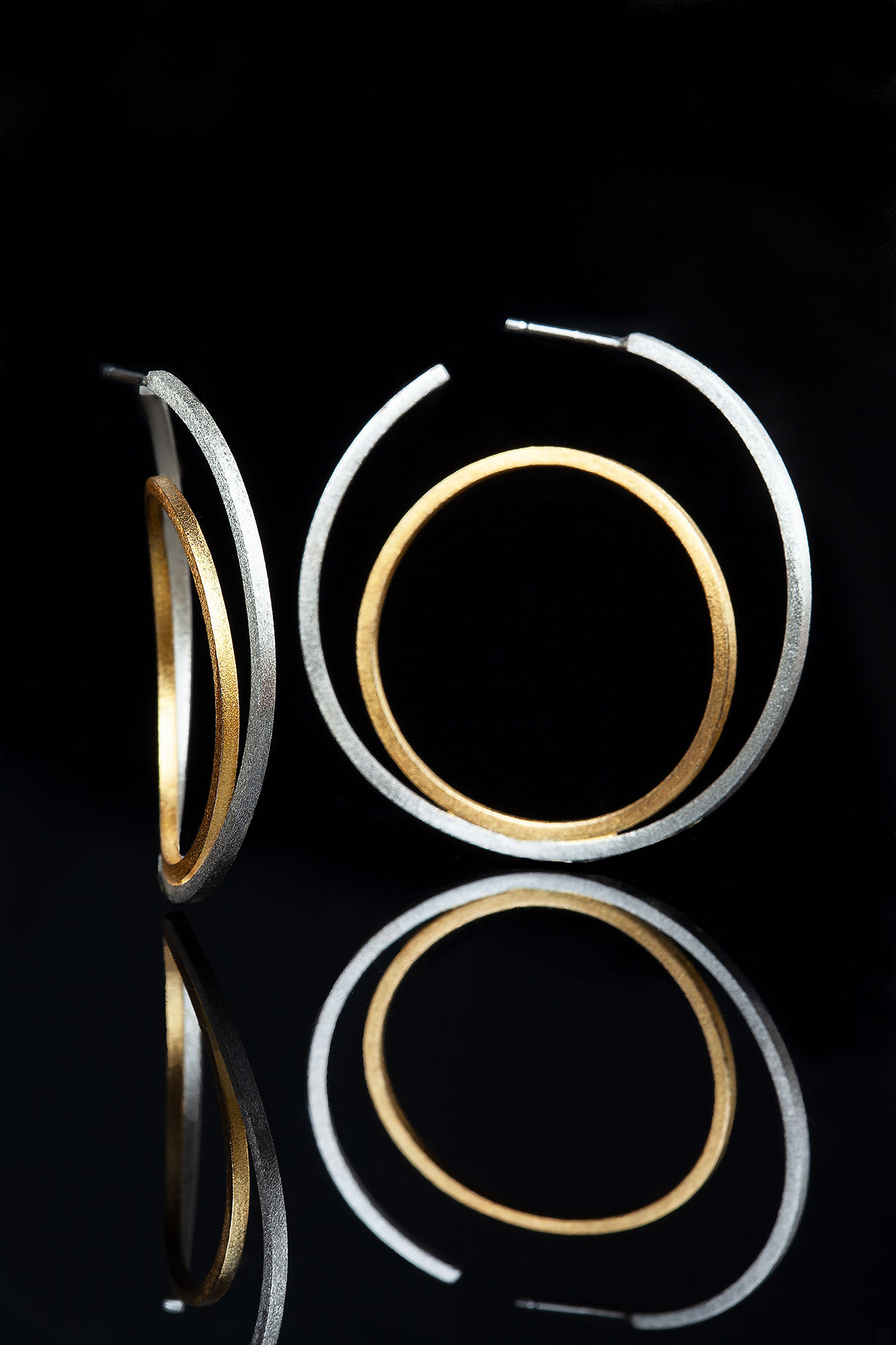 Minimal geometric handmade double silver hoops main